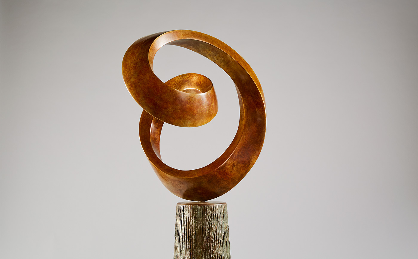 abstract curved fluid bronze sculpture