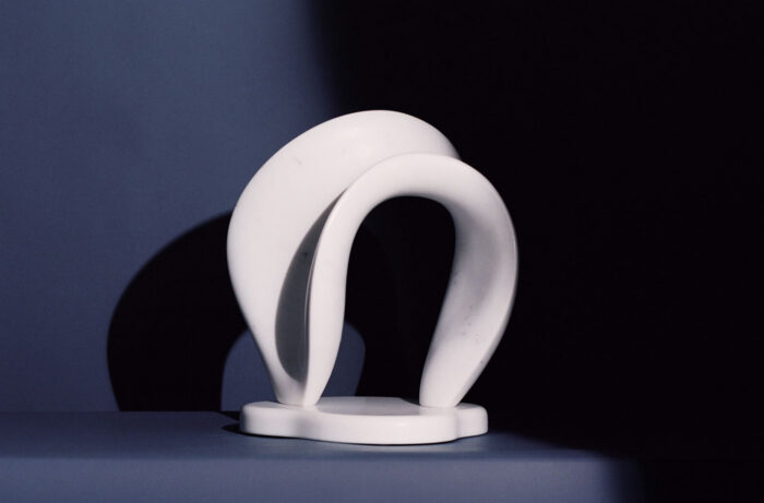 white marble abstract sculpture of a wave