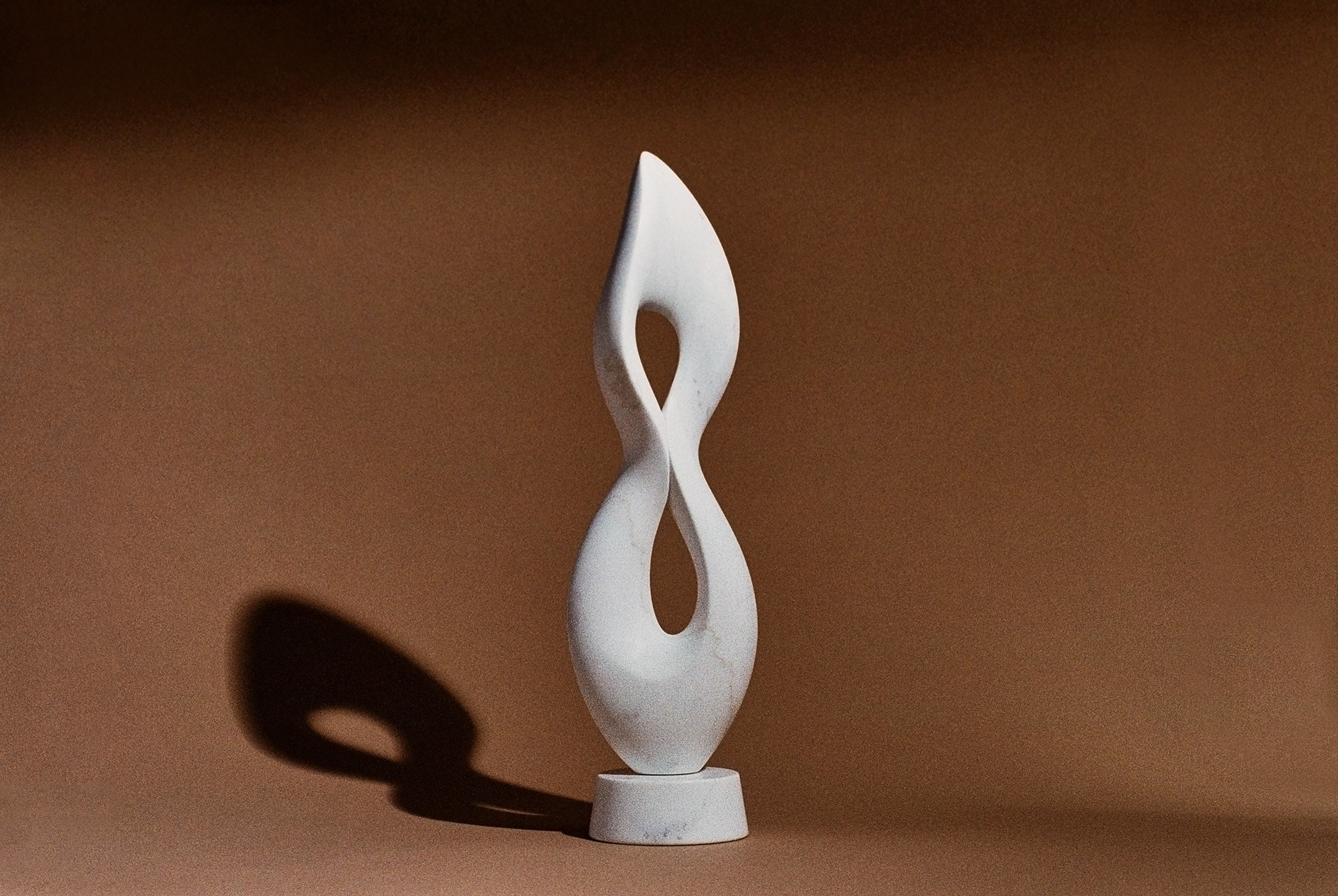 Meditative abstract sculpture in white marble