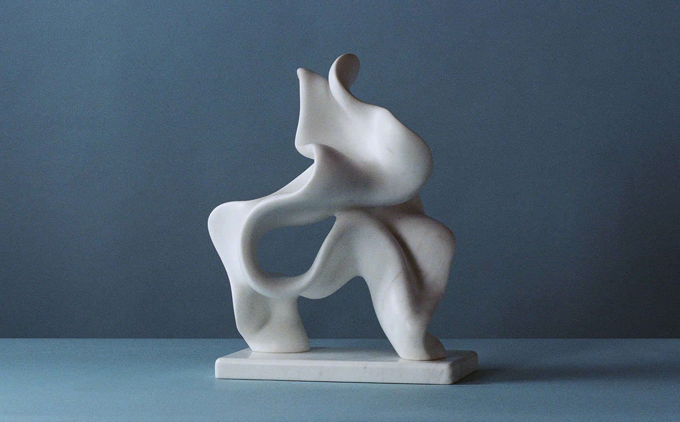 white marble abstract sculpture for sale in front of blue background